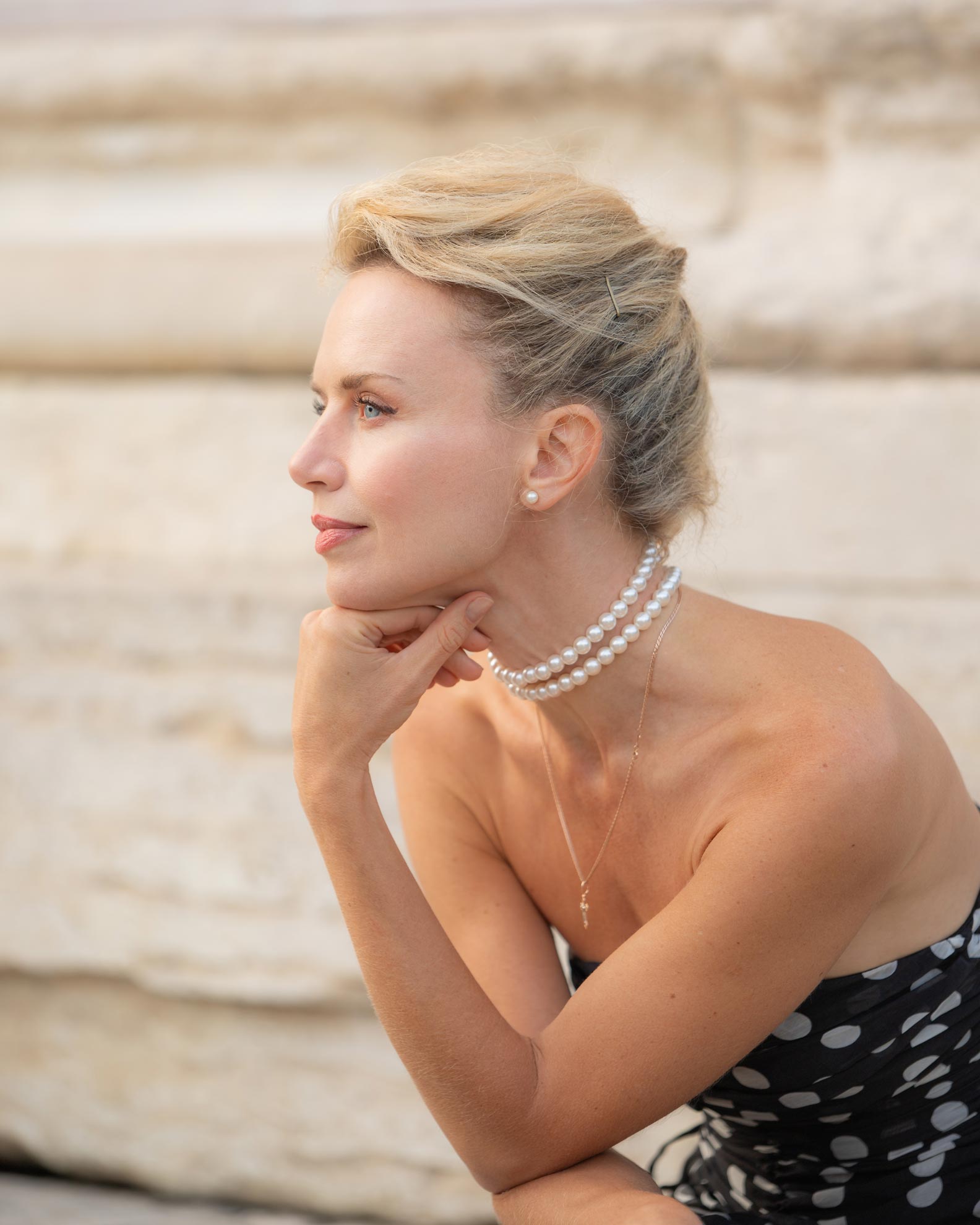 Side profile portrait of a woman with braided hair