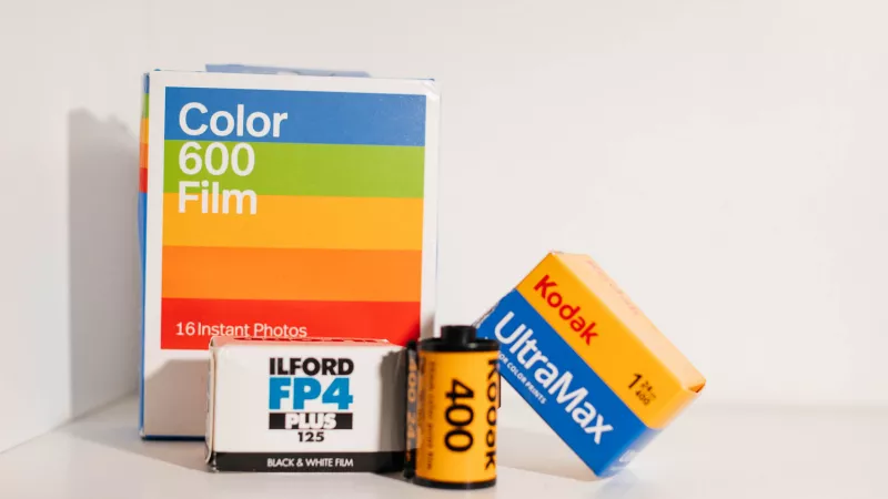 Ilford FP4 black and white film, Kodak UltraMax colour film and Polaroid Color 600 — three film types side by side