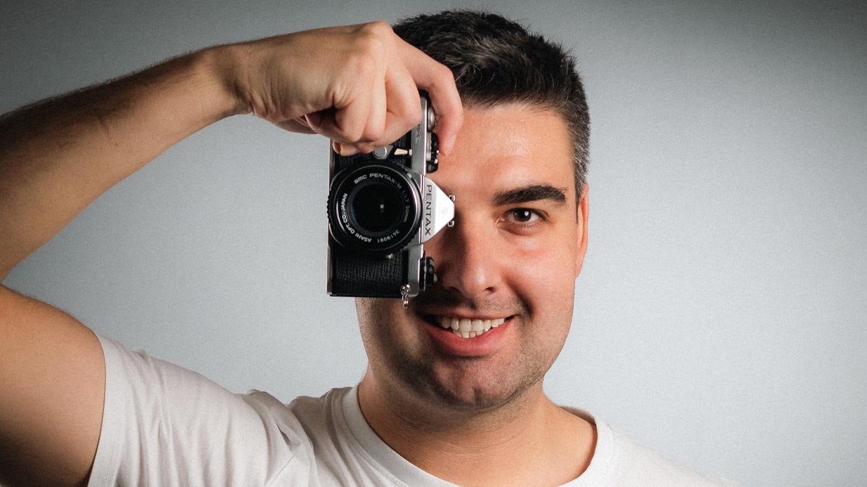 smiling young man with a pentax me-super