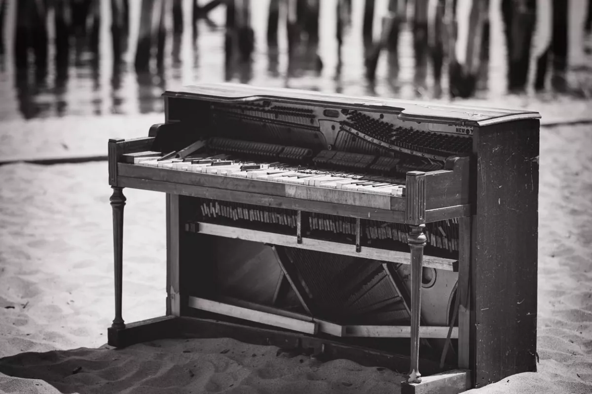 old broken piano on a beach in cape cod