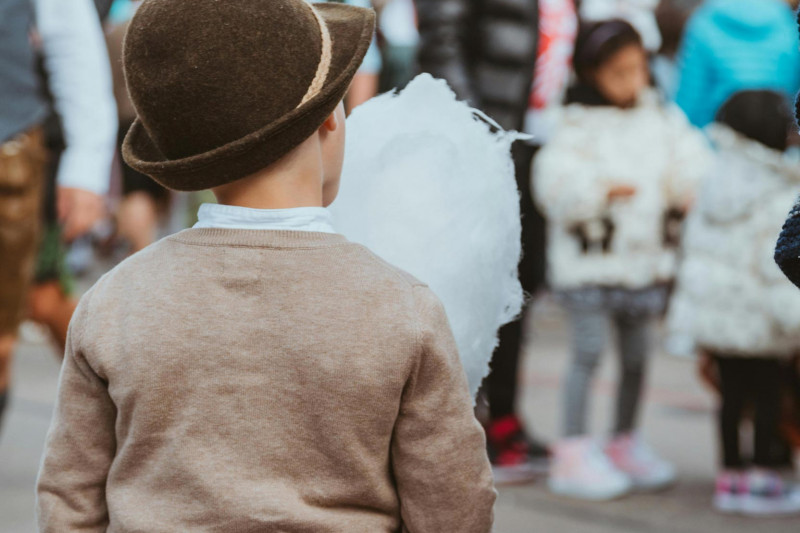 A child enjoys some cotton candy at Oktoberfest in Munich