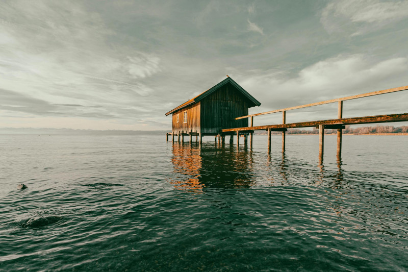 A wooden house on Lake Ammersee on a sunny morning
